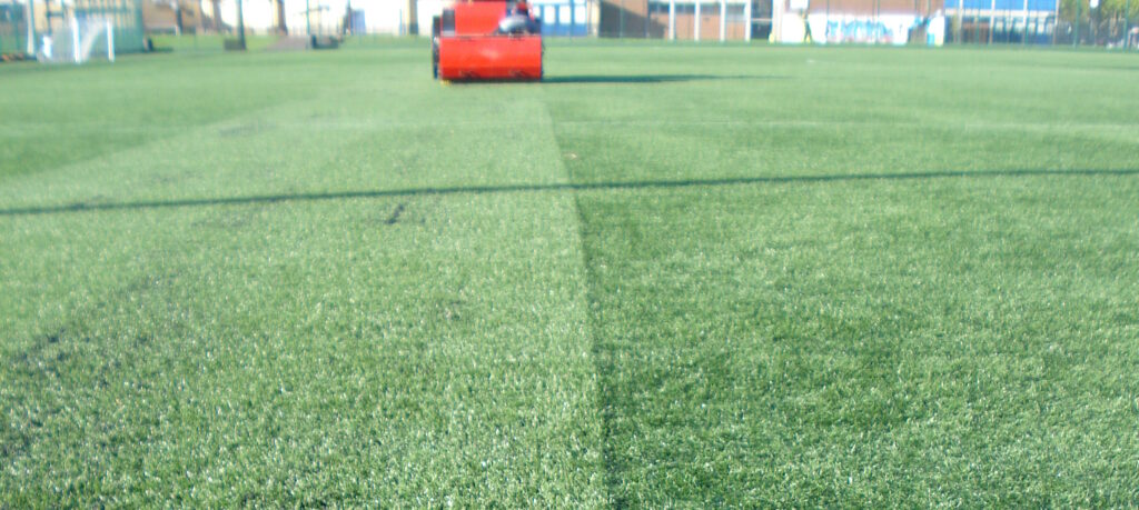 Artificial Grass Cleaning Machine Verti-Top in distance